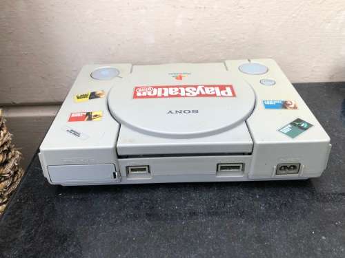 ORIGINAL PLAYSTATION CONSOLE WITH REMOTES , MEMORY CARDS AND 4 ORIGINAL GAMES - WORKING