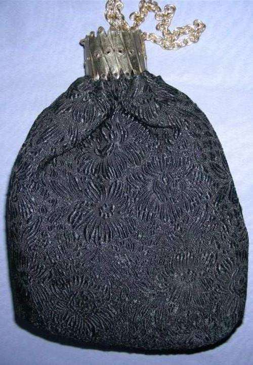 Vintage handbag with concertina closure - black embossed material