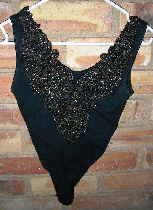 Beautiful Black body suit with gold trim - size 12