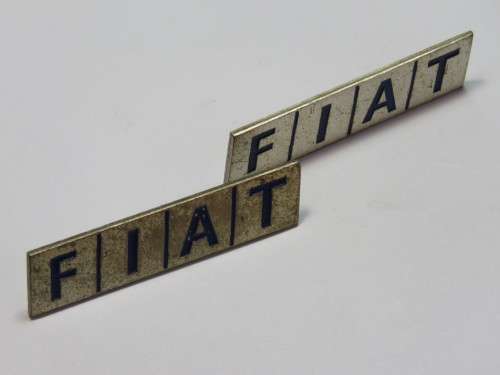 Pair of vintage FIAT brooches