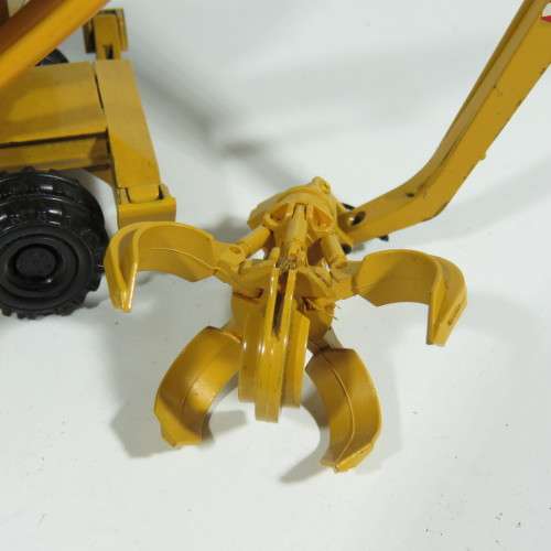 Conrad #2832 Liebherr 932 Litronic excavator with grapple die-cast construction model - Scale 1/50