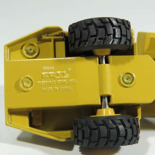 ERTL Caterpillar D25D articulated dump truck die-cast construction model - Scale 1/64
