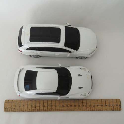 Pair of RASTAR remote control cars - Not tested - No remotes - 27 MHZ
