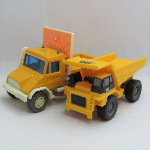 Pair of construction toy trucks