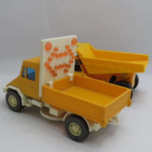 Pair of construction toy trucks