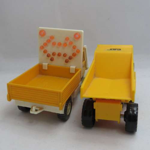 Pair of construction toy trucks