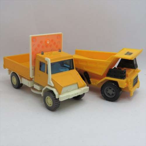 Pair of construction toy trucks