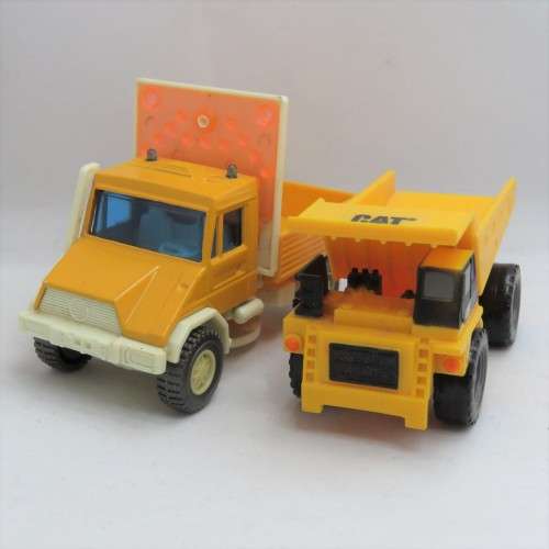 Pair of construction toy trucks