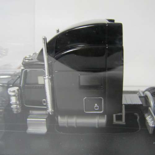 Norscot Peterbilt model 389 with trail king Lowboy trailer and CAT 315C