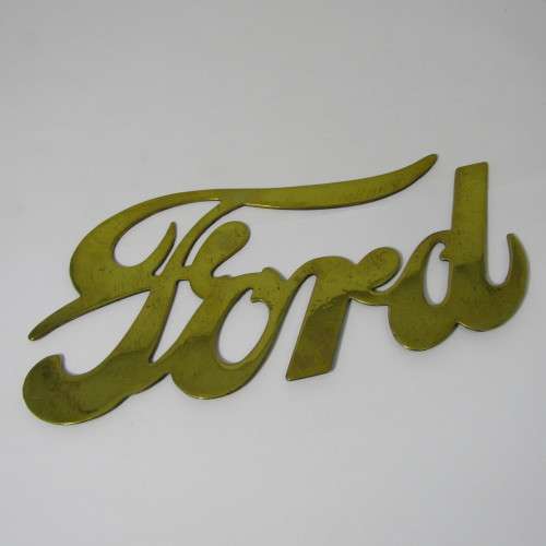 Antique brass Ford Model T radiator grille badge