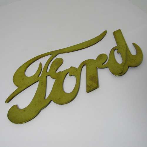 Antique brass Ford Model T radiator grille badge