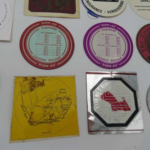 Lot of 11 vintage car license stickers and other related items