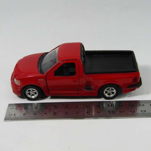 Jada Toys 1999 F-150 SVT Lighting model car - scale 1/32