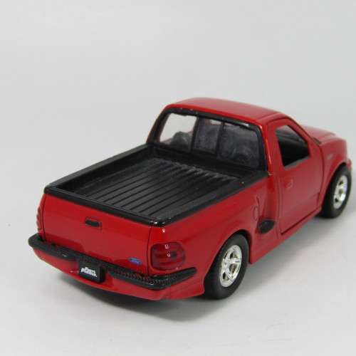 Jada Toys 1999 F-150 SVT Lighting model car - scale 1/32