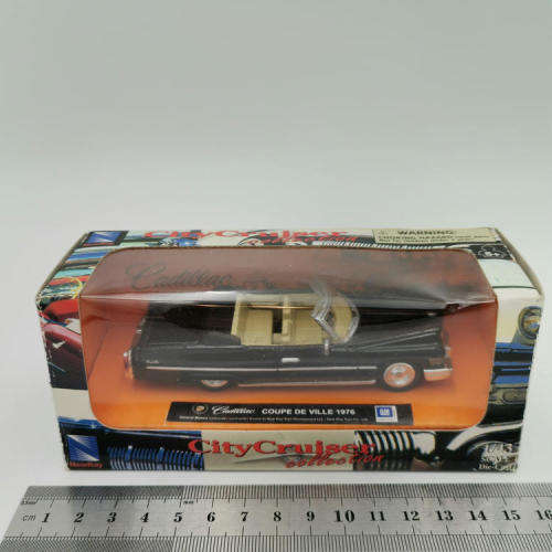 NewRay 1976 Cadillac Coupe de Ville die-cast model car - Scale 1/43