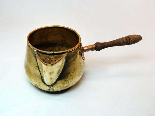Small vintage brass and copper milk pot with wooden handle