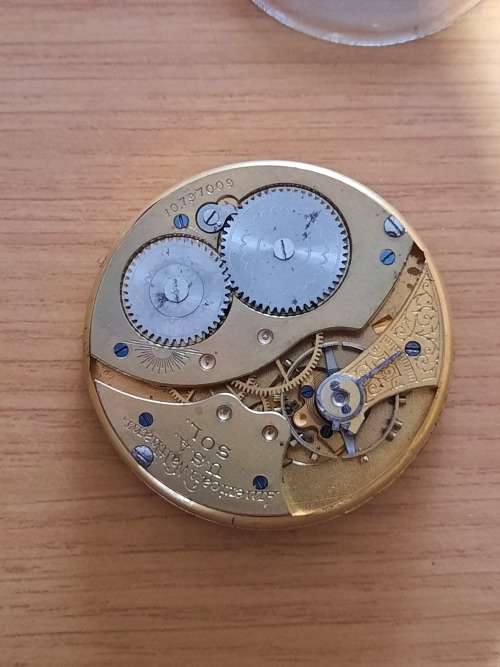 vintage pocket watch movement and glass