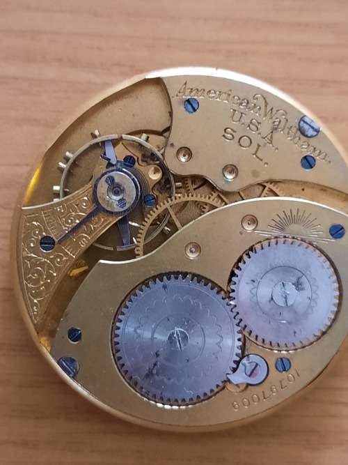 vintage pocket watch movement and glass