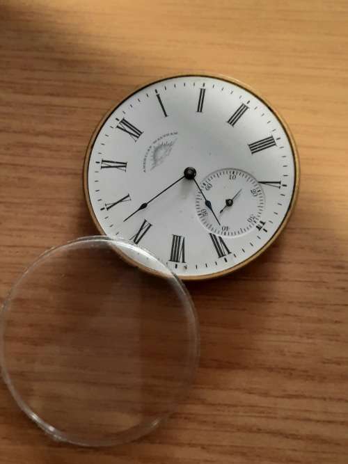 vintage pocket watch movement and glass