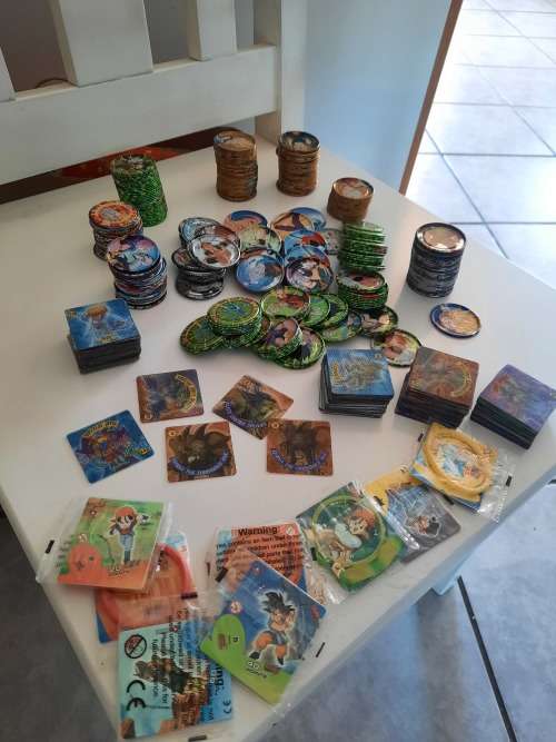 Tin metal Tazos 283in total plus 114 simba tv cards yu -gi -oh