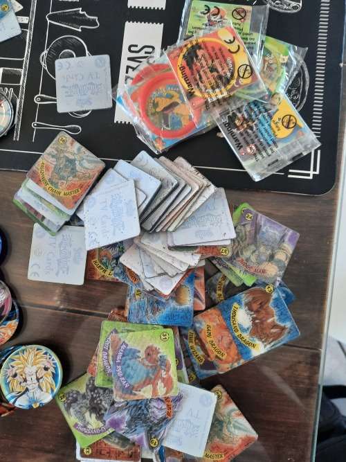 Tin metal Tazos 283in total plus 114 simba tv cards yu -gi -oh