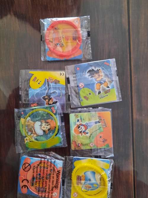 Tin metal Tazos 283in total plus 114 simba tv cards yu -gi -oh