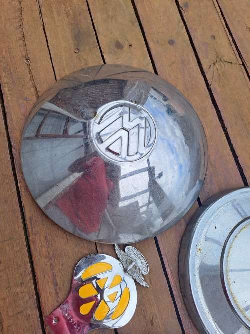 Vintage car vw wheel caps and car badge ect