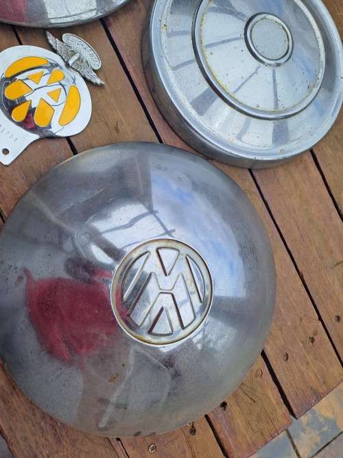 Vintage car vw wheel caps and car badge ect