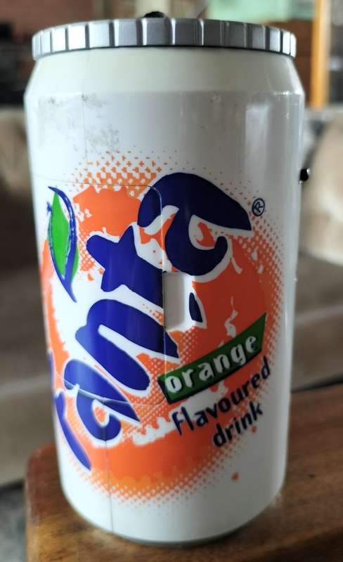 Vintage plastic camera in shape of Fanta Orange can