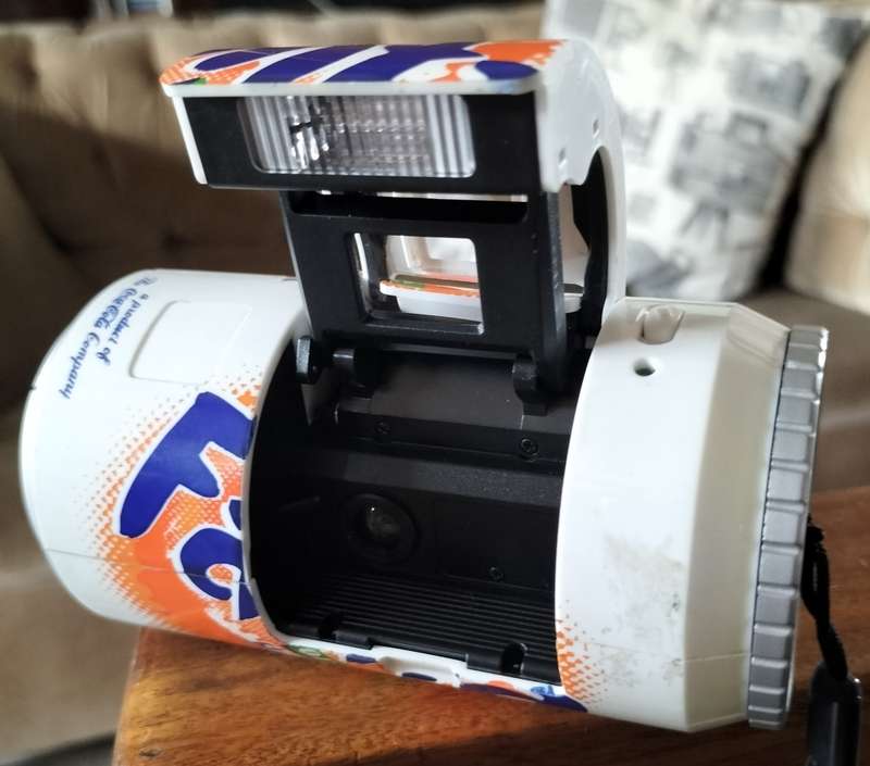 Vintage plastic camera in shape of Fanta Orange can