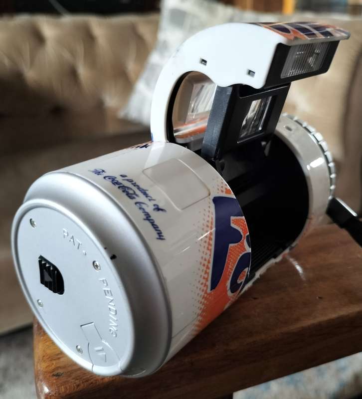 Vintage plastic camera in shape of Fanta Orange can