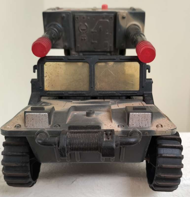 Vintage gun-mounted plastic Jeep
