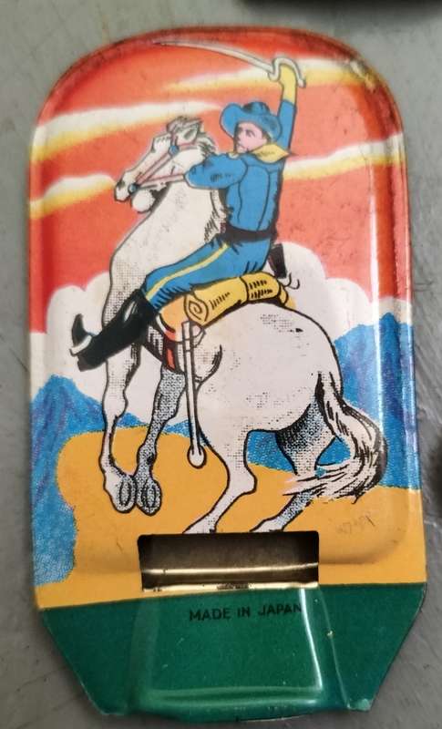 Vintage tin toy collection of whistles and clickers (x11)