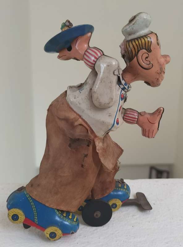 Vintage tin toy - humorous waiter on wheels