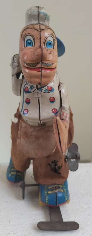 Vintage tin toy - humorous waiter on wheels