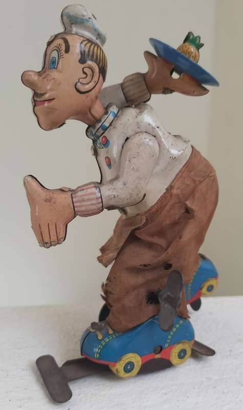 Vintage tin toy - humorous waiter on wheels