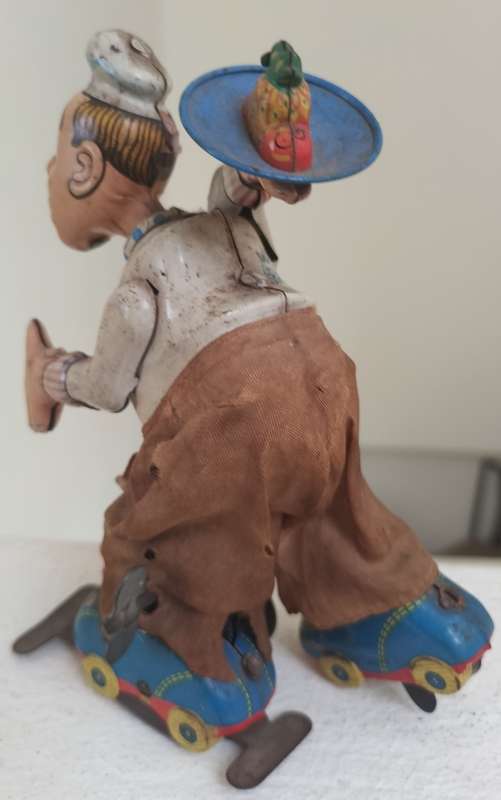 Vintage tin toy - humorous waiter on wheels