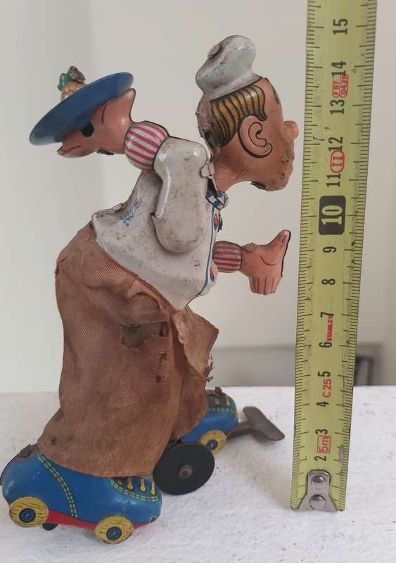 Vintage tin toy - humorous waiter on wheels