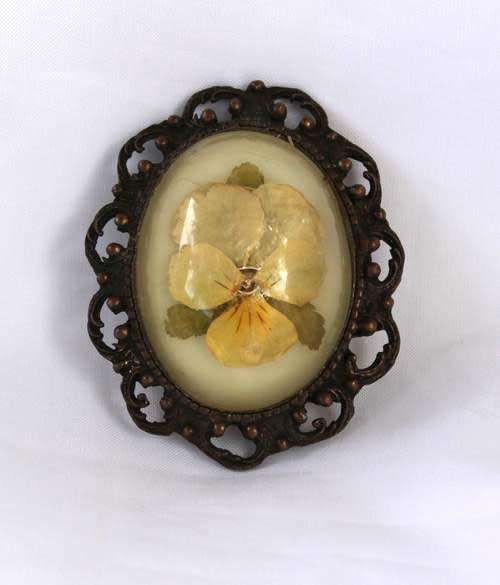 Vintage style floral brooch. Glass dome set in antique bronze setting