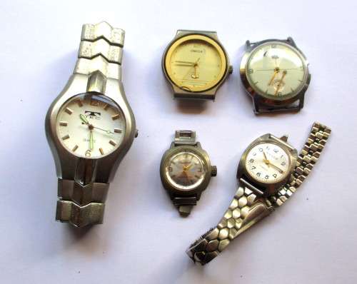 Lot of Five Watches. Not working. Good for Parts or just needs battery.