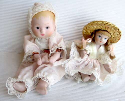 Two Antique Small Porcelain Dolls Arms and Legs Attached by an Elastic Band. Size as per photo.