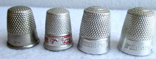 Lot of four Vintage Thumbles. Various sizes. Marked.