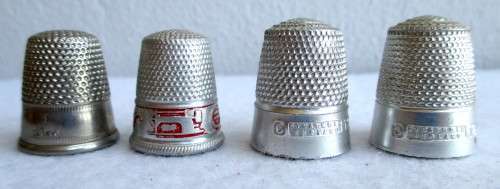 Lot of four Vintage Thumbles. Various sizes. Marked.
