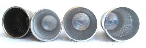 Lot of four Vintage Thumbles. Various sizes. Marked.