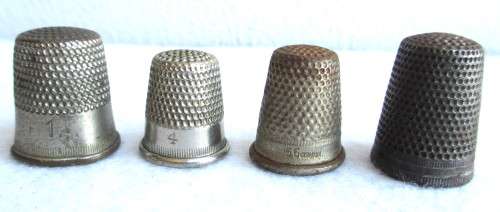 Lot of four Vintage Thumbles. Various sizes. Marked.