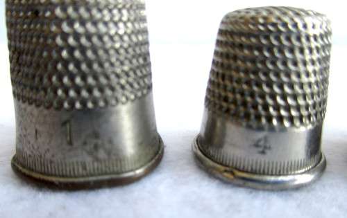 Lot of four Vintage Thumbles. Various sizes. Marked.