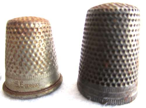 Lot of four Vintage Thumbles. Various sizes. Marked.