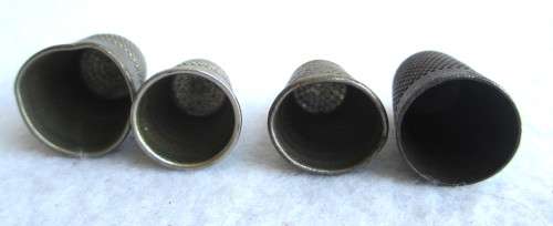 Lot of four Vintage Thumbles. Various sizes. Marked.