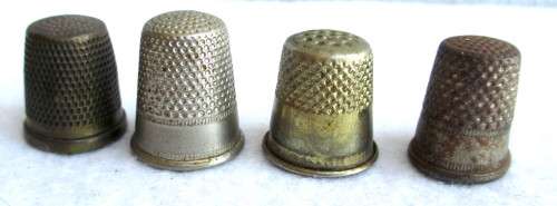 Lot of four Vintage Thumbles. Various sizes. Marked.