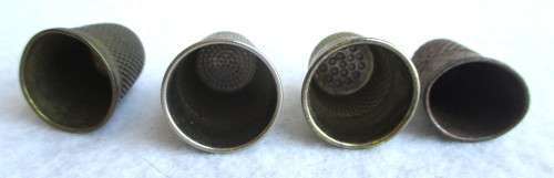Lot of four Vintage Thumbles. Various sizes. Marked.